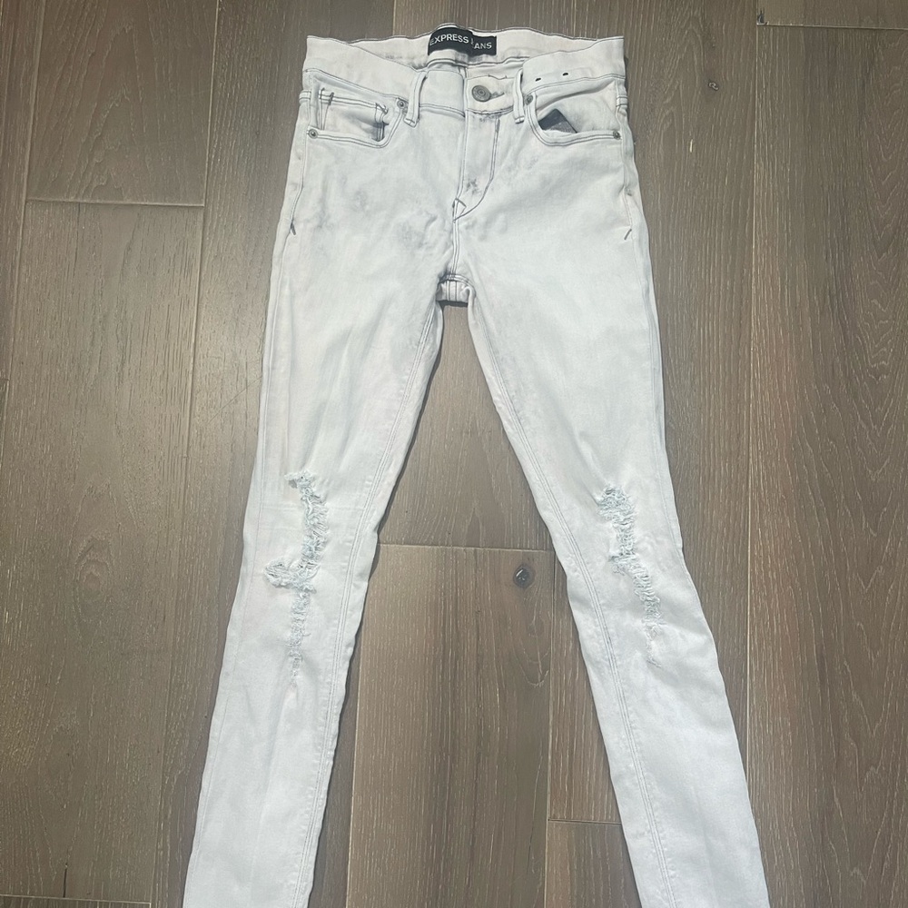 Women’s Express denim leggings mid rise. Good condition. Signs of use size 4